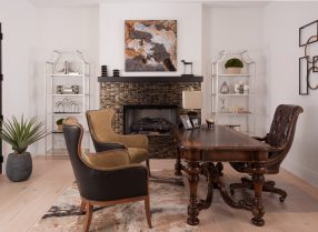 home office WARM TRANSITIONAL HOME OFFICE Adding warm tones and a variety of textures create an engaging compliment between old and new. The modern artwork and silver leafed iron and glass etagere loaded with beautiful accessories complete the look and amp up the style.